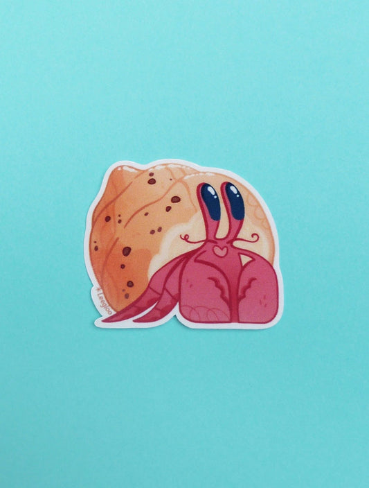 Autocollant en forme de Bernard l'hermite avec une coquille en forme de brioche.